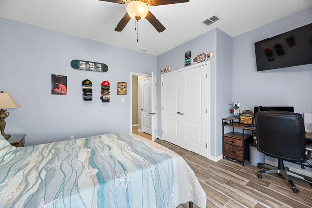 a bedroom with a workspace