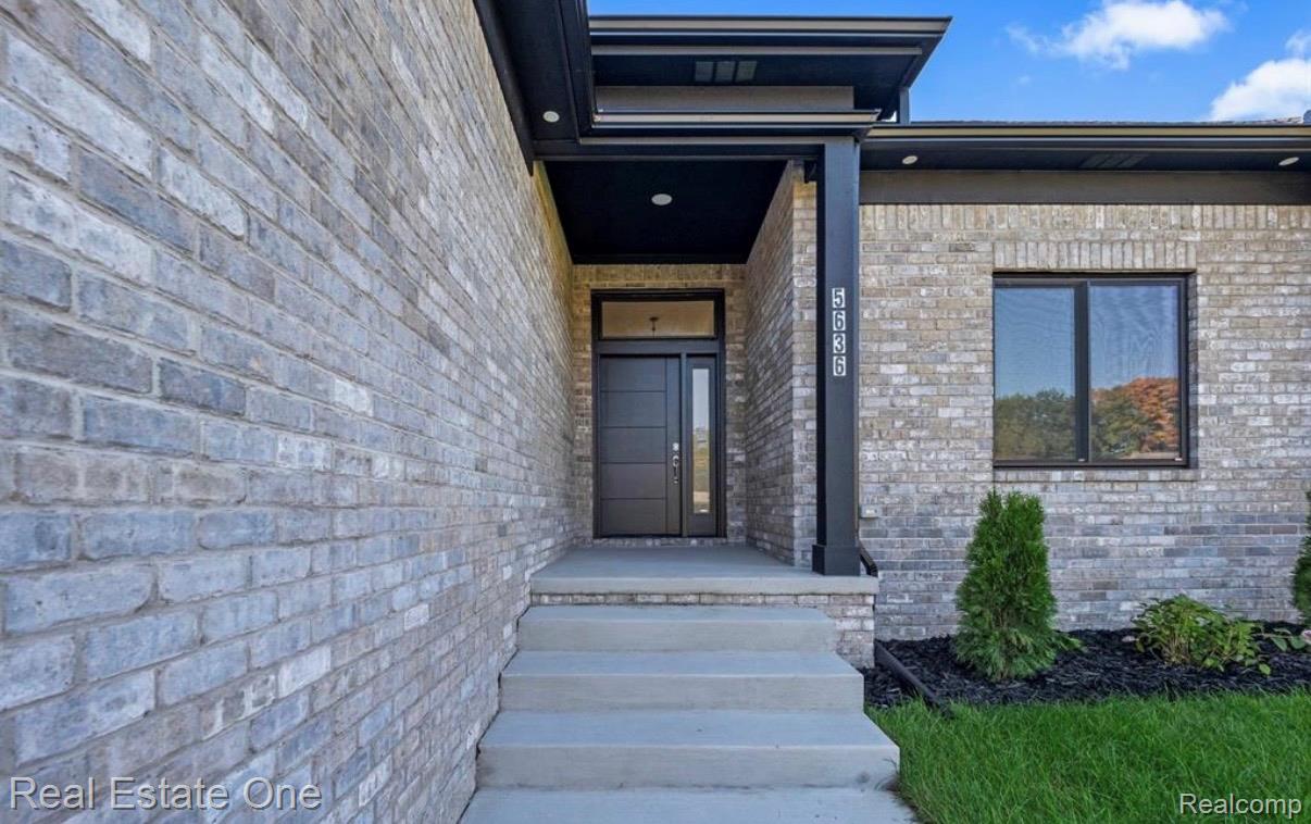 5636 Paris Street Sterling Heights, MI 48310 - Photo 4 of 37 Entrance to property featuring brick siding