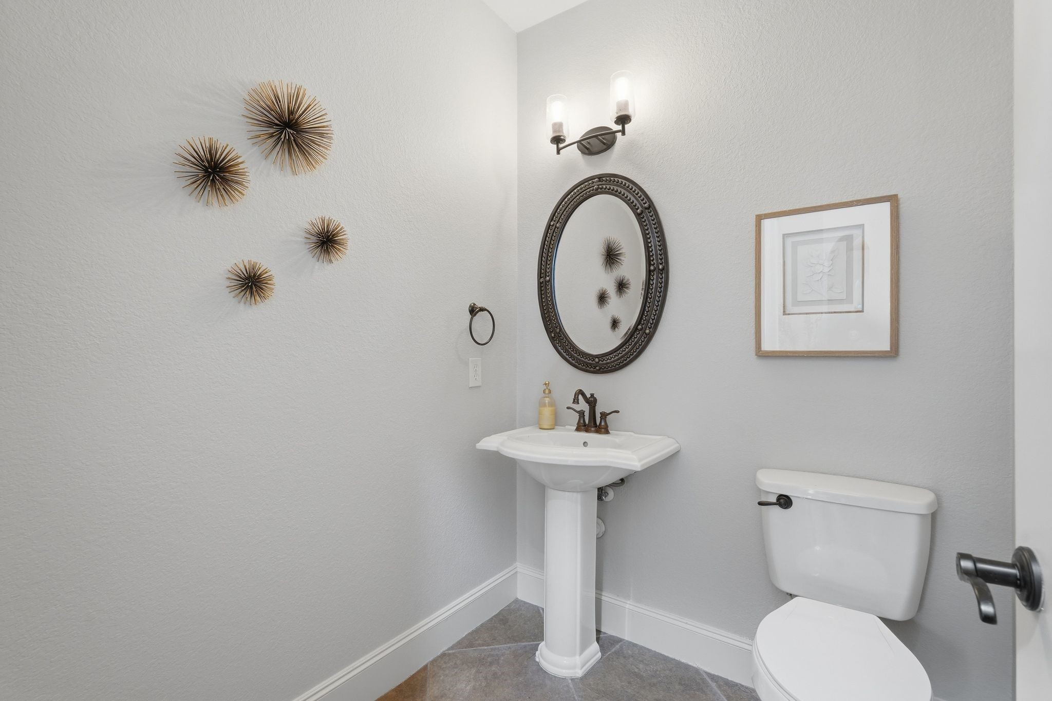 7603 Hogan Bridge Court Spring, TX 77389 - Photo 7 of 50 Perfectly placed powder bath near the main living spaces.