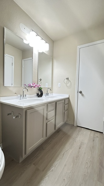 5211 Viewpoint Drive Austin, TX 78744 - Photo 11 of 25 a spacious bathroom with a double vanity sink mirror and toilet