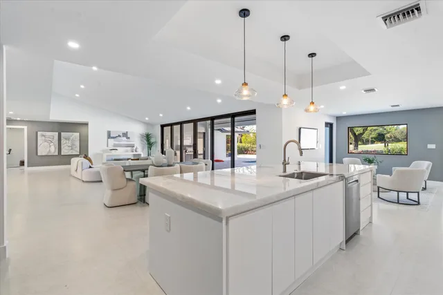 a bathroom with a toilet a sink and bathtub