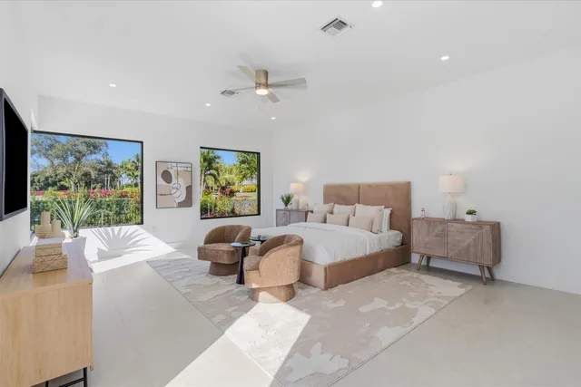 a view of yard with swimming pool and green space