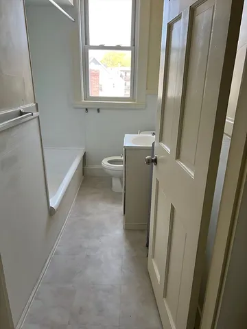 a view of a bathroom with a sink and a mirror