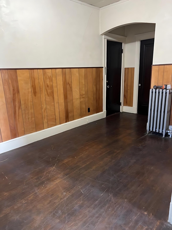 71 Harwood Street, Unit 12 Lynn, MA 01902 - Photo 5 of 5 an empty room with wooden floor and windows