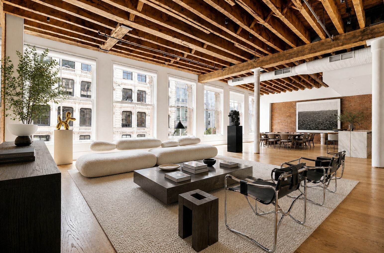 62 Wooster Street, Unit 4 Manhattan, NY 10010 - Photo 1 of 13 a living room with patio furniture and a flat screen tv