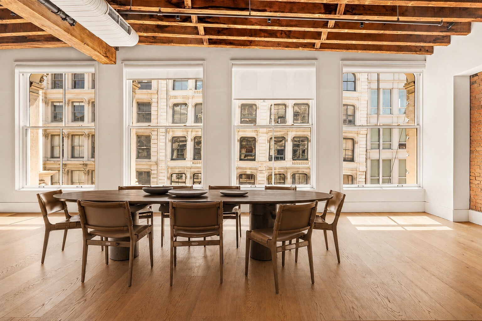 62 Wooster Street, Unit 4 Manhattan, NY 10010 - Photo 3 of 13 a view of a dining room with furniture and wooden floor
