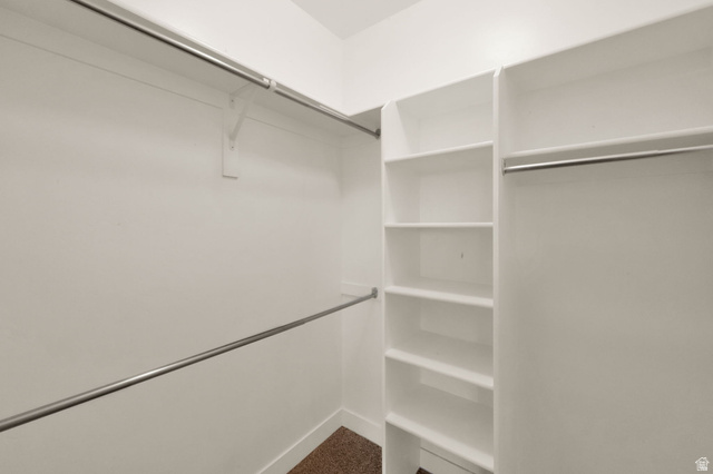 1823 North Crest Road Saratoga Springs, UT 84045 - Photo 11 of 18 Walk in closet featuring dark colored carpet