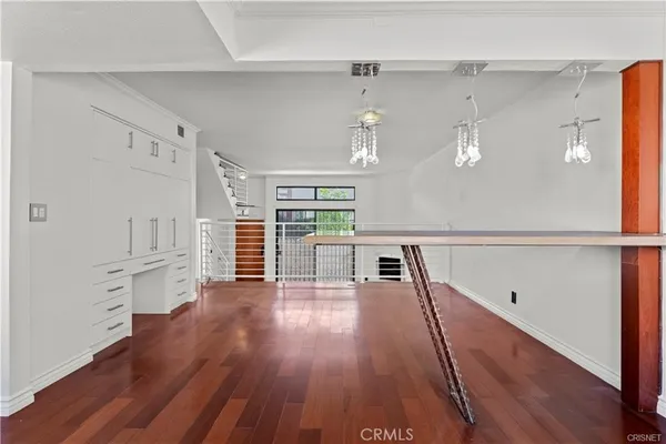 a view of a livingroom with wooden floor