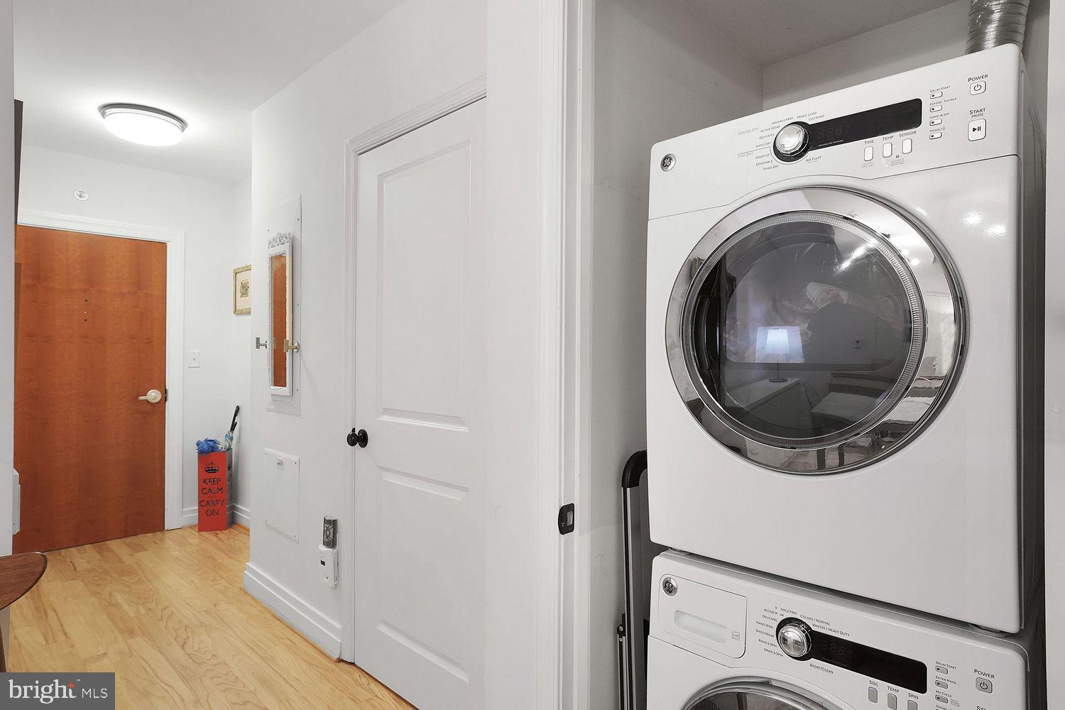 915 E Street Northwest, Unit 403 Washington, DC 20004 - Photo 19 of 30 a view of a hallway with washer and dryer