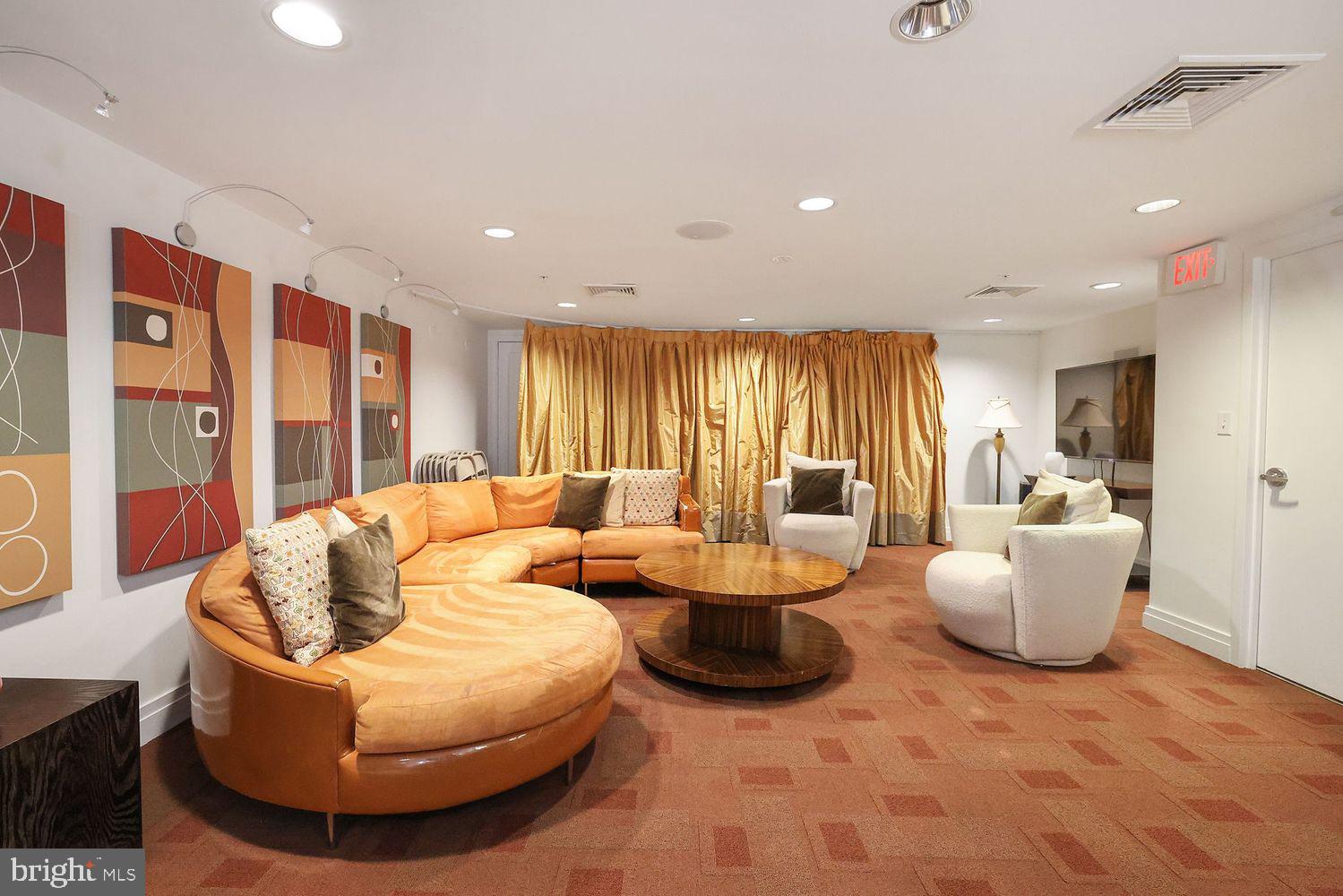 915 E Street Northwest, Unit 403 Washington, DC 20004 - Photo 25 of 30 a living room with furniture and large windows