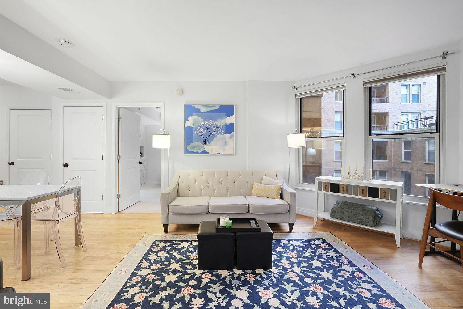 915 E Street Northwest, Unit 403 Washington, DC 20004 - Photo 4 of 30 a living room with furniture and a rug