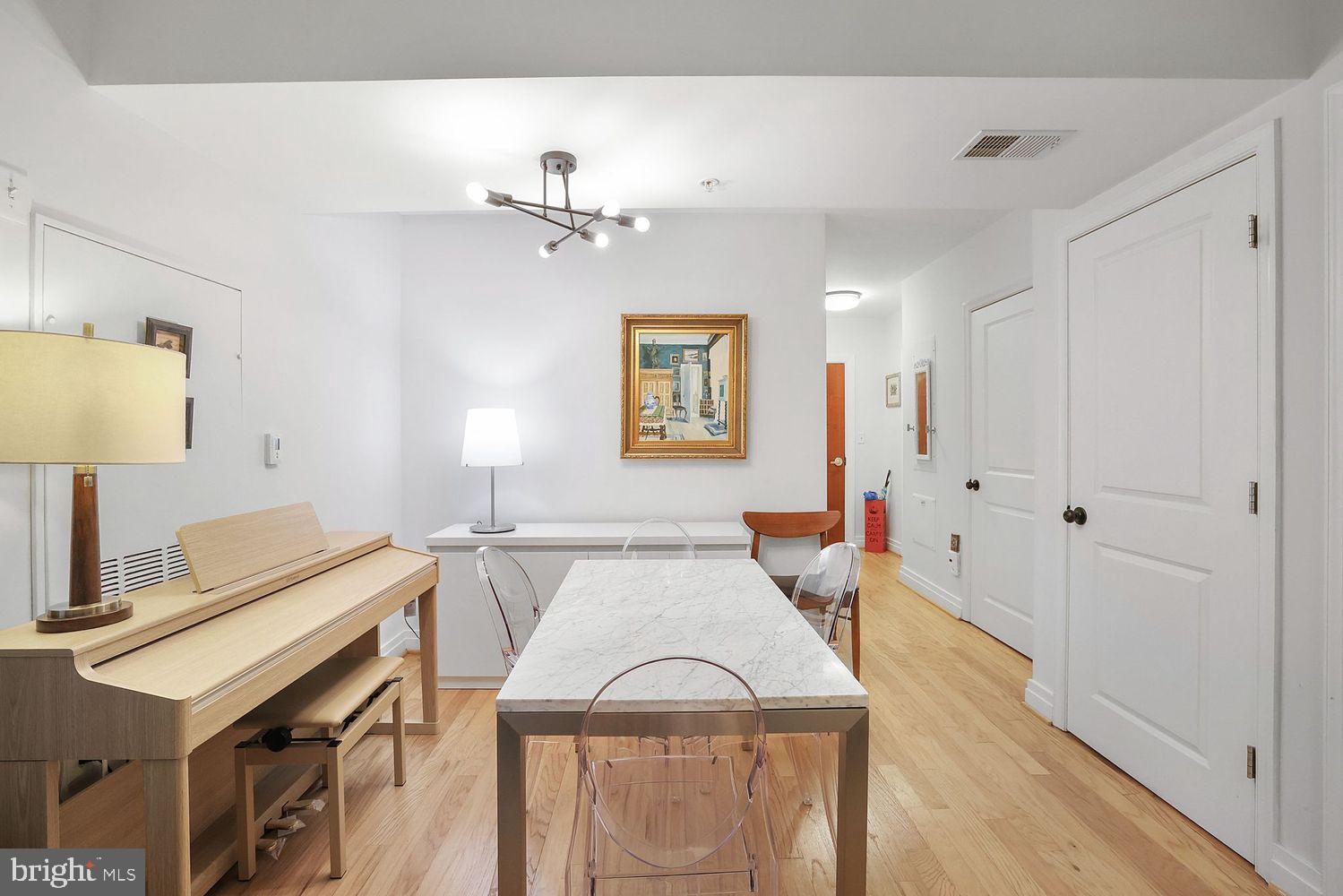 915 E Street Northwest, Unit 403 Washington, DC 20004 - Photo 8 of 30 a view of a livingroom with furniture and wooden floor