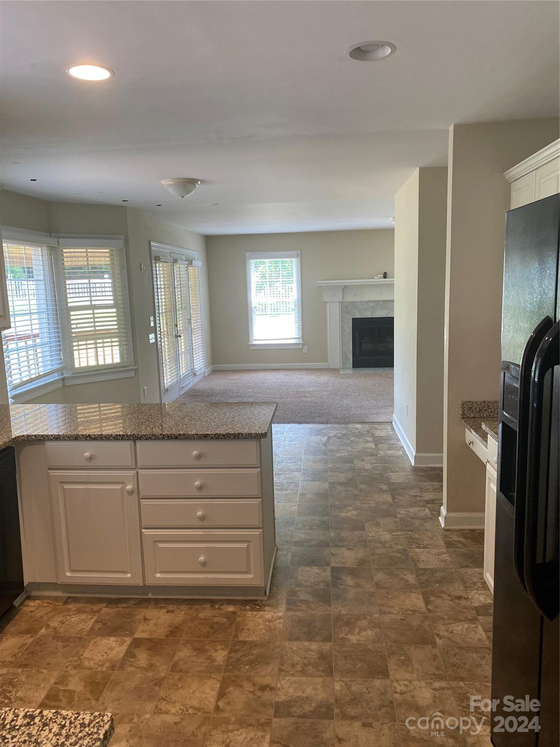 1623 Caille Court Fort Mill, SC 29708 - Photo 11 of 41 a view of kitchen with granite countertop a sink and a refrigerator