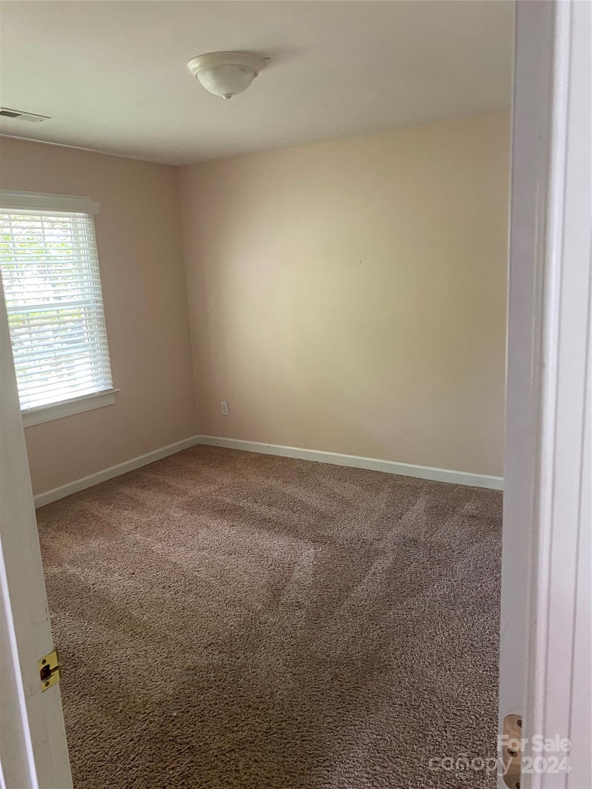 1623 Caille Court Fort Mill, SC 29708 - Photo 39 of 41 an empty room with a window