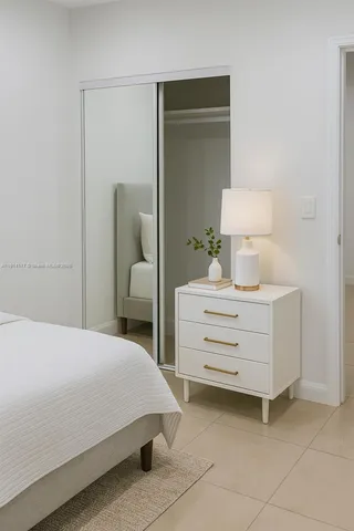 a bedroom with a bed and lamp