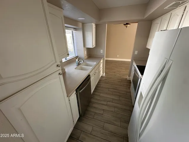 a bathroom with sink and mirror