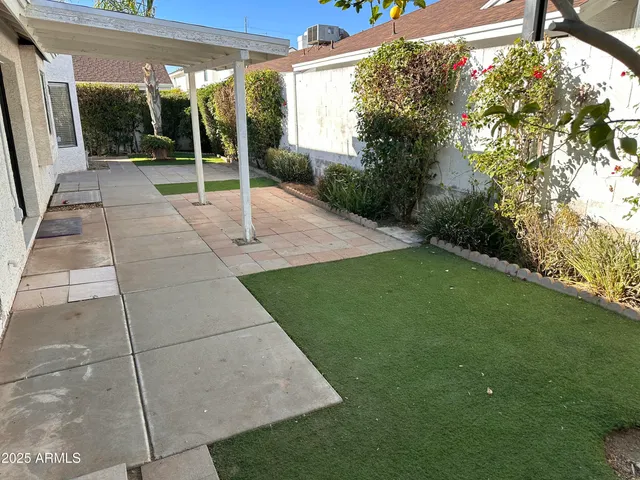a view of a backyard with garden