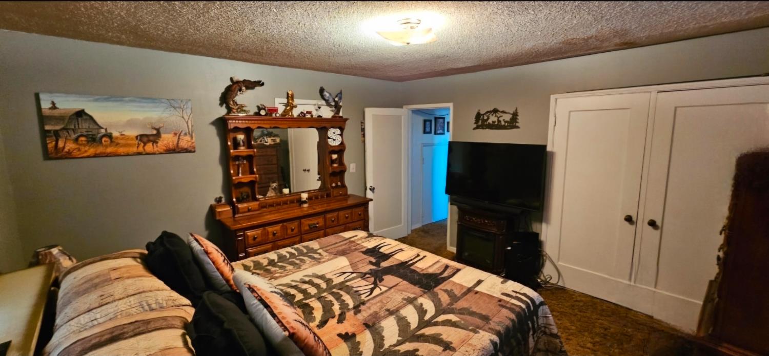 20822 Disch Road Lockeford, CA 95237 - Photo 11 of 30 a bedroom with a bed and a mirror