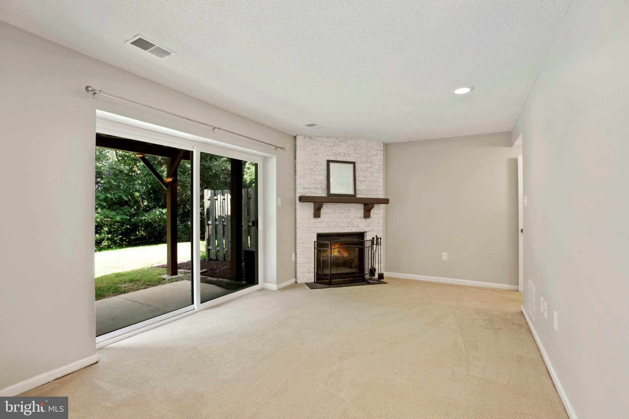 11366 Baroque Road Silver Spring, MD 20901 - Photo 20 of 26 Lower Level Family/Rec Room with fireplace