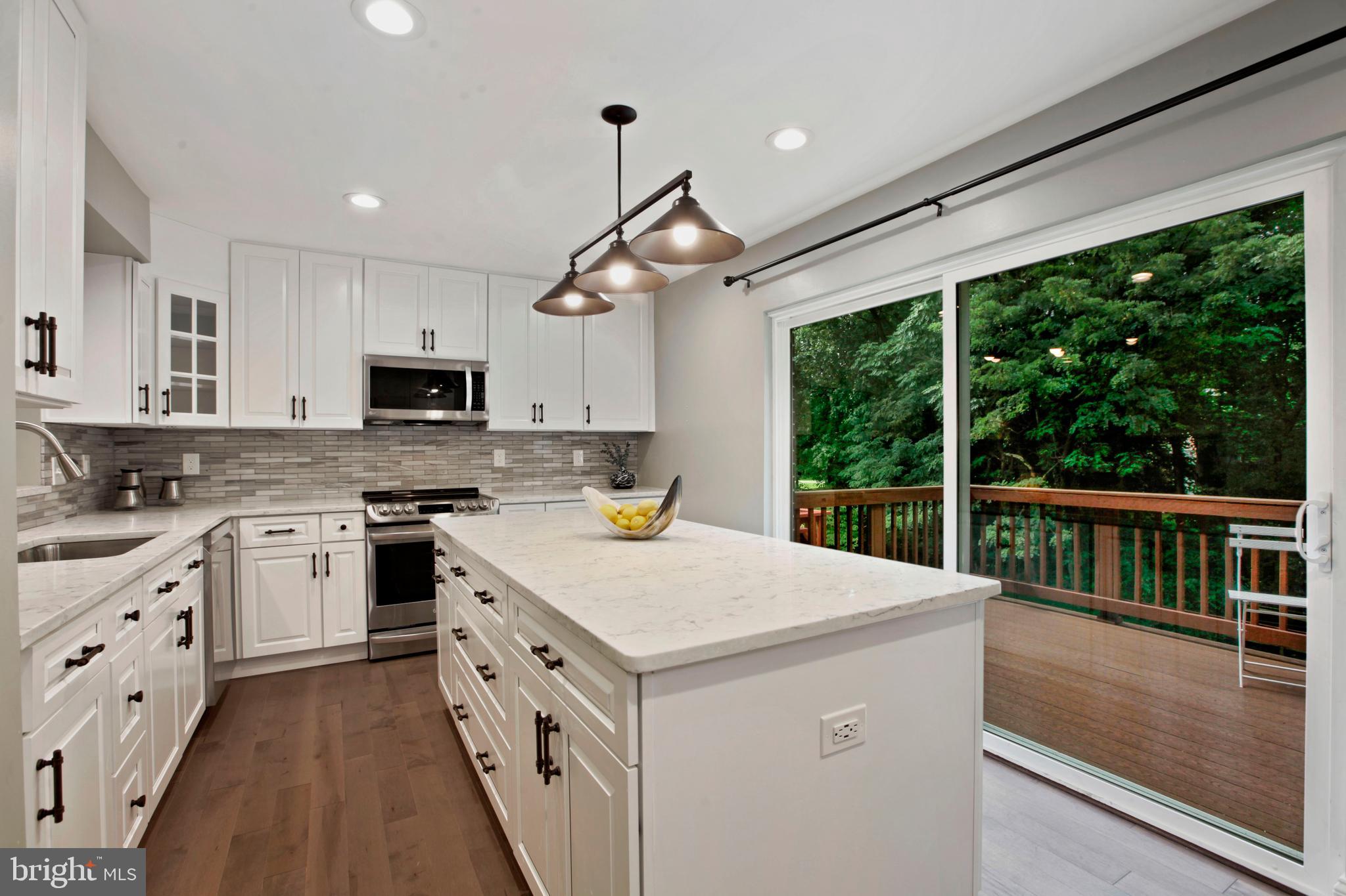 11366 Baroque Road Silver Spring, MD 20901 - Photo 5 of 26 Gorgeous, remodeled kitchen leading to deck