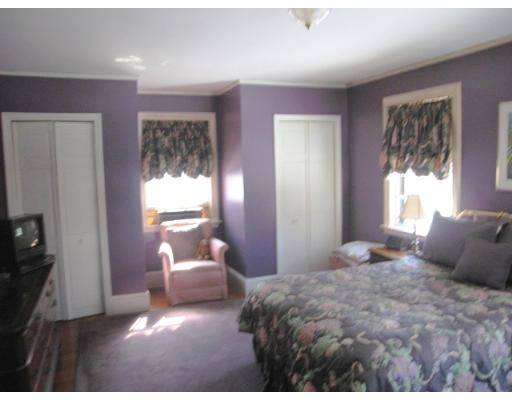 48 Nehoiden Road Newton, MA 02468 - Photo 6 of 6 a bedroom with a bed and a large window