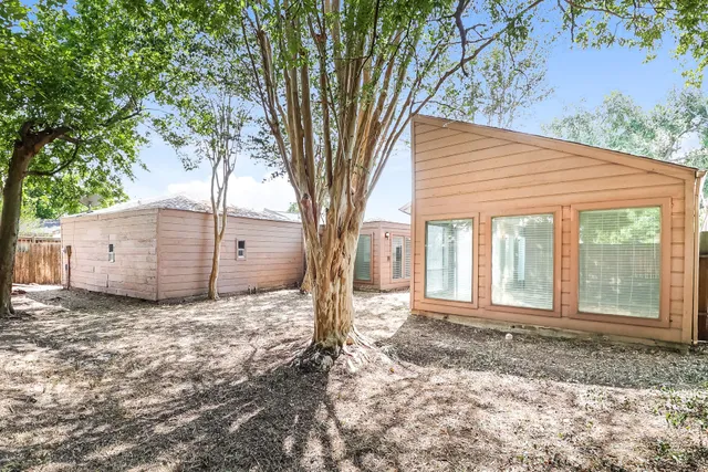 a house with a tree in the background
