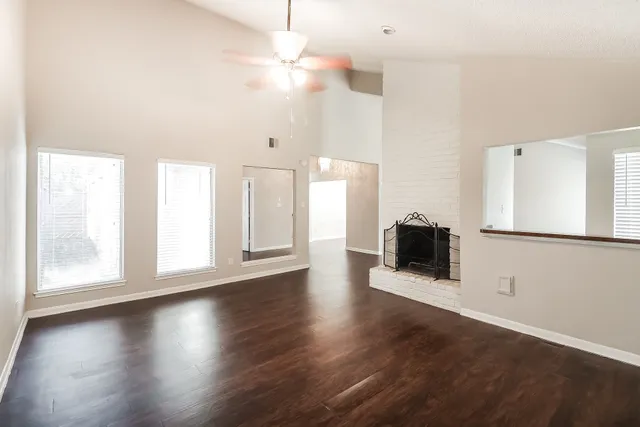 a view of a kitchen with a dishwasher cabinets and a large window