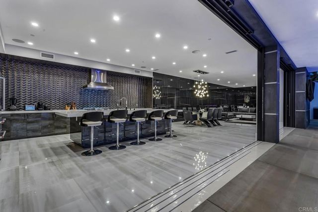 a room with a cabinet and a large window