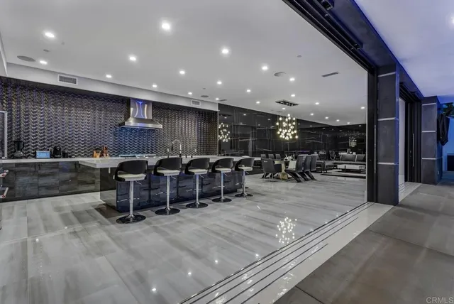 a room with a cabinet and a large window