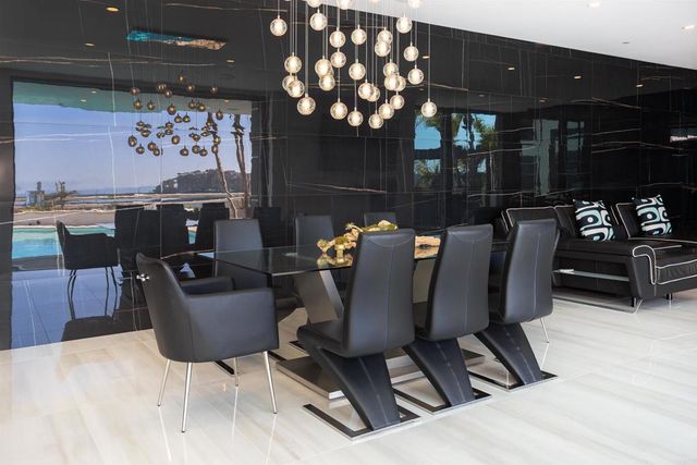 a view of a swimming pool with a yard