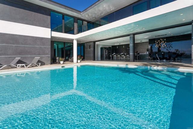 a kitchen with a sink a stove and a refrigerator