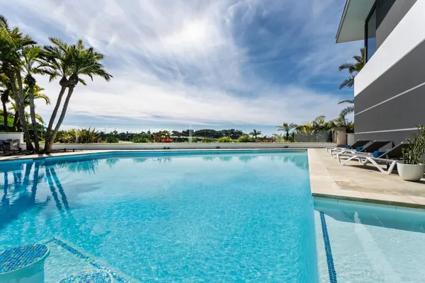 a kitchen with a sink a stove and a refrigerator