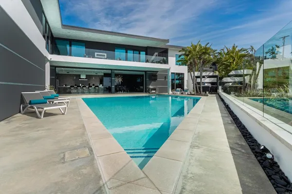 a view of a balcony with two chairs and a table