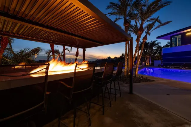 a large bed sitting in a bedroom next to a lamp