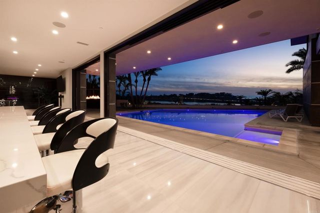 a bedroom with a bed and painting on the wall