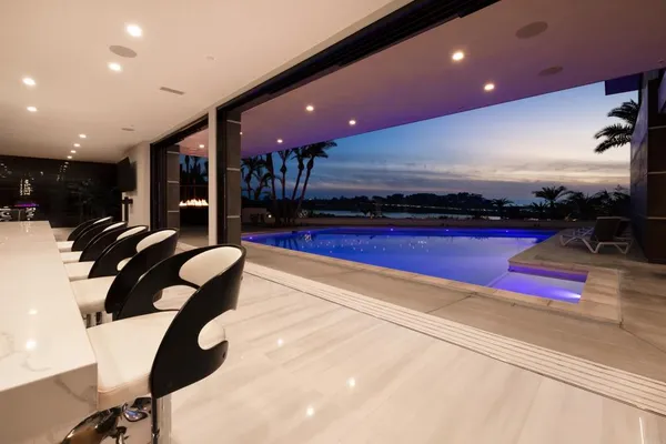 a bathroom with a sink a toilet a mirror and shower