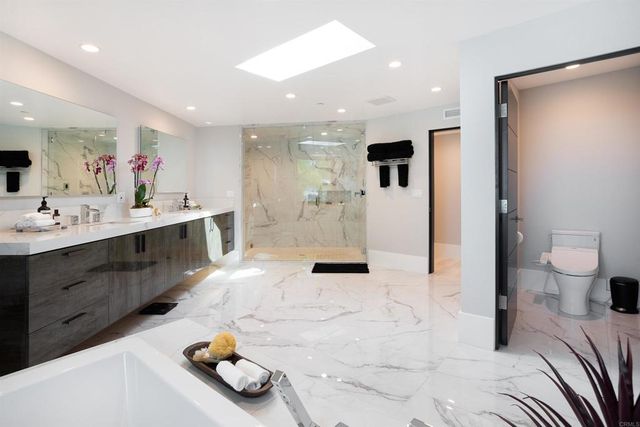 an aerial view of a residential houses with outdoor space