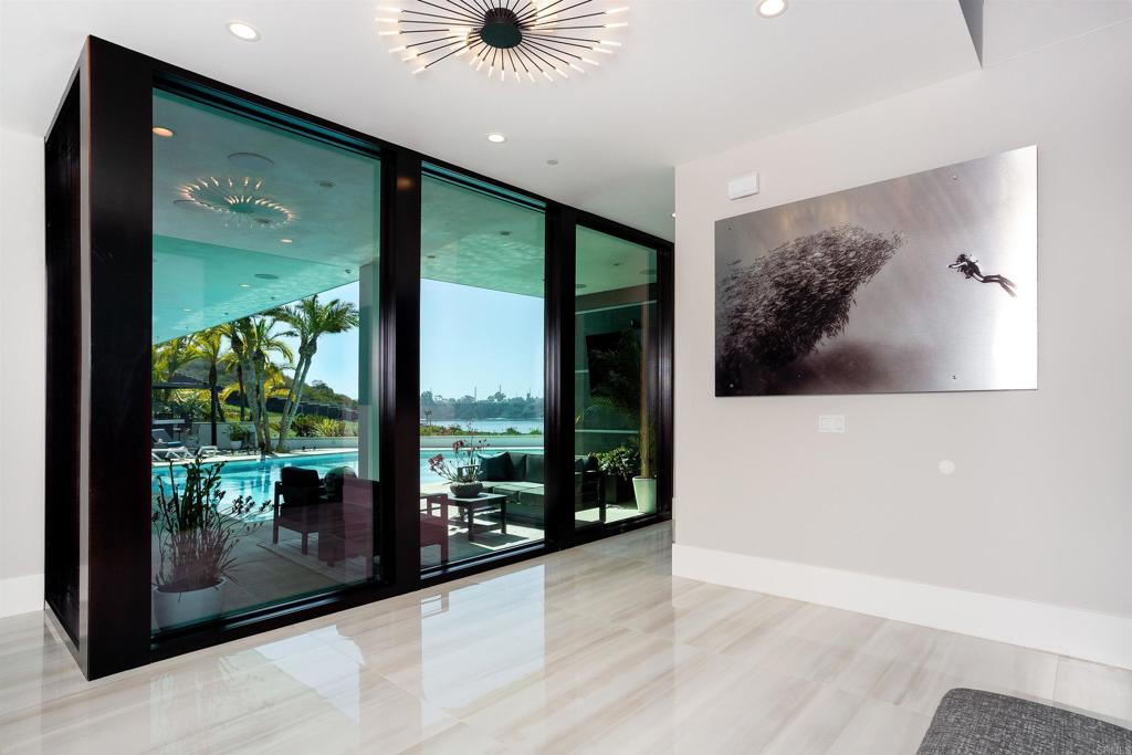 1095 Hoover Street Carlsbad, CA 92008 - Photo 10 of 75 a view of a hallway with a floor to ceiling window
