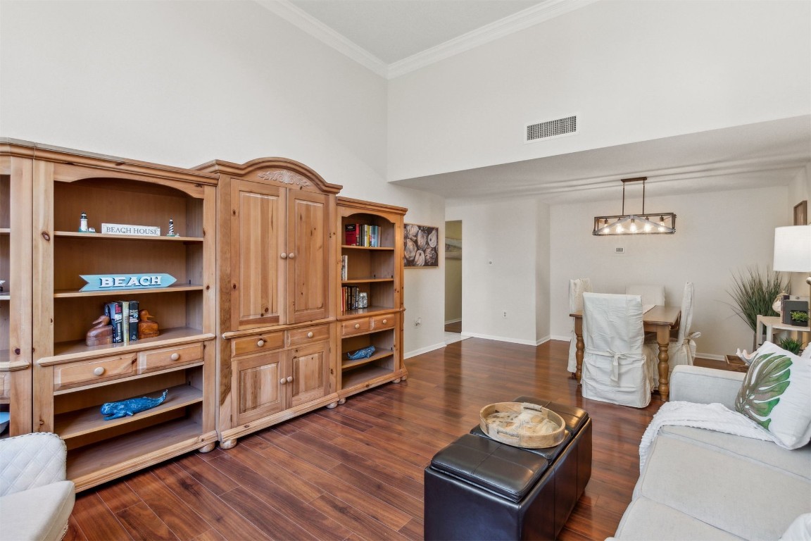 1163 Beach Walker Road, Unit 1163 Fernandina Beach, FL 32034 - Photo 11 of 52 a living room with furniture and a book shelf