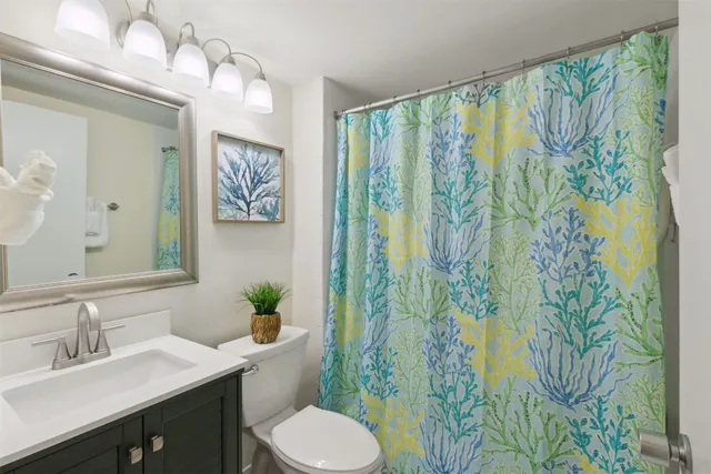 a view of a balcony with chair and the potted plant next to a window