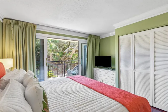 a view of a balcony with couches and wooden floor