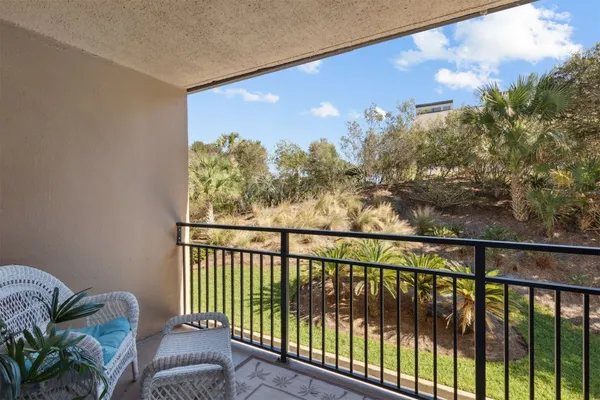 a view of a green yard from a balcony