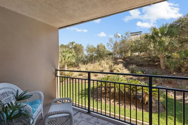 a view of a green yard from a balcony