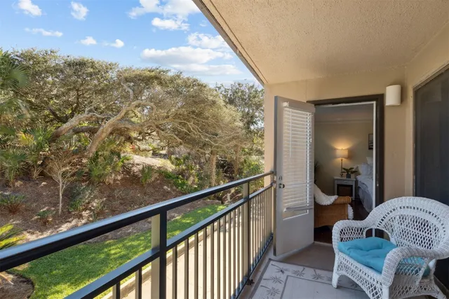 a bedroom with a bed and a table