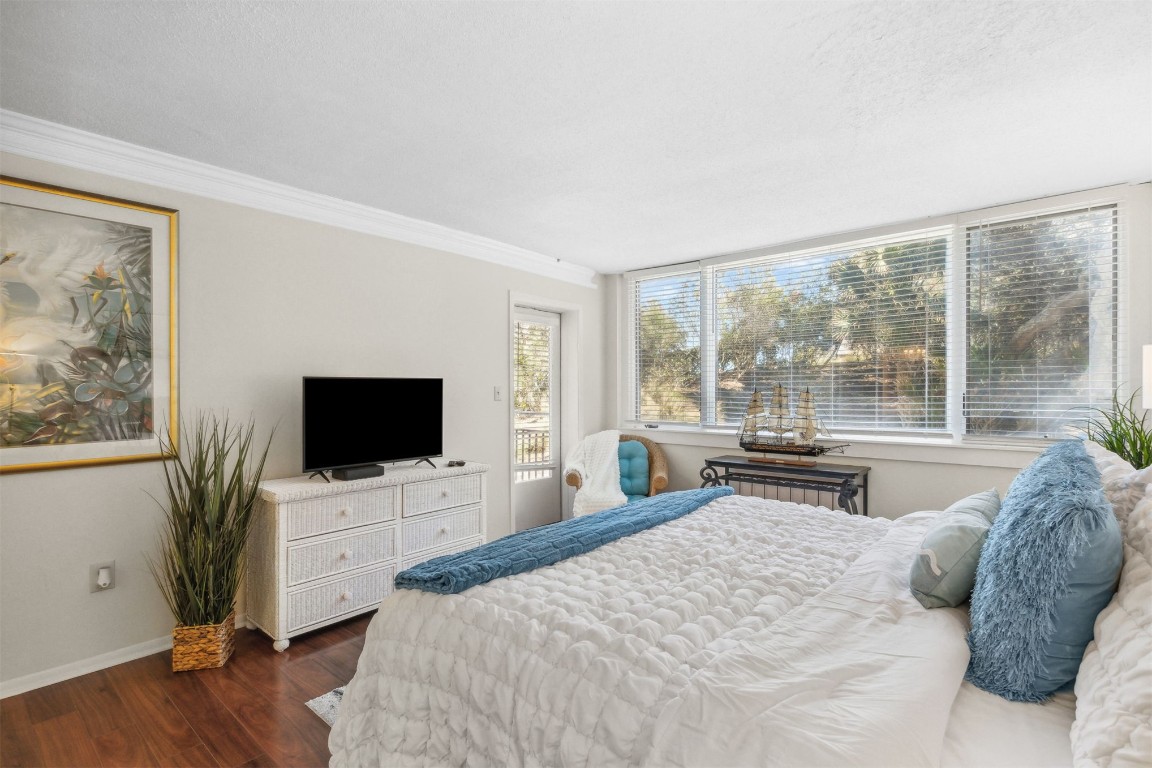 1163 Beach Walker Road, Unit 1163 Fernandina Beach, FL 32034 - Photo 29 of 52 a bedroom with a bed and a flat screen tv