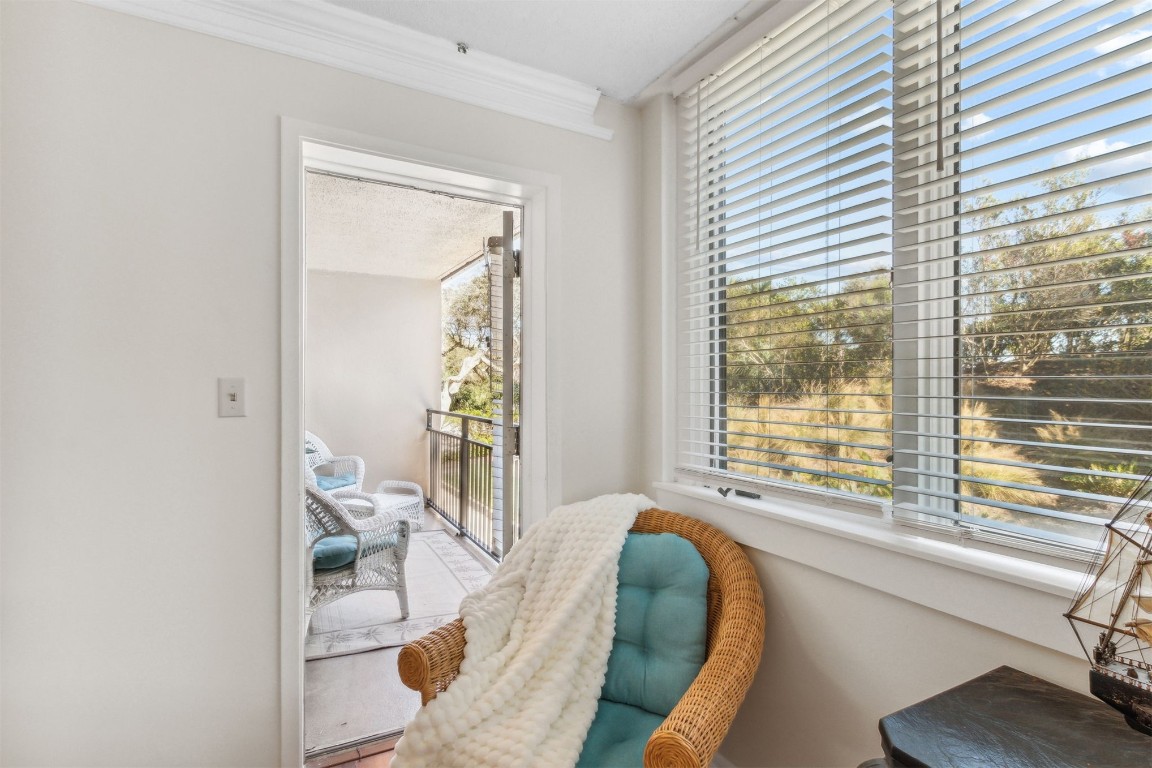 1163 Beach Walker Road, Unit 1163 Fernandina Beach, FL 32034 - Photo 31 of 52 a living room with furniture and a large window