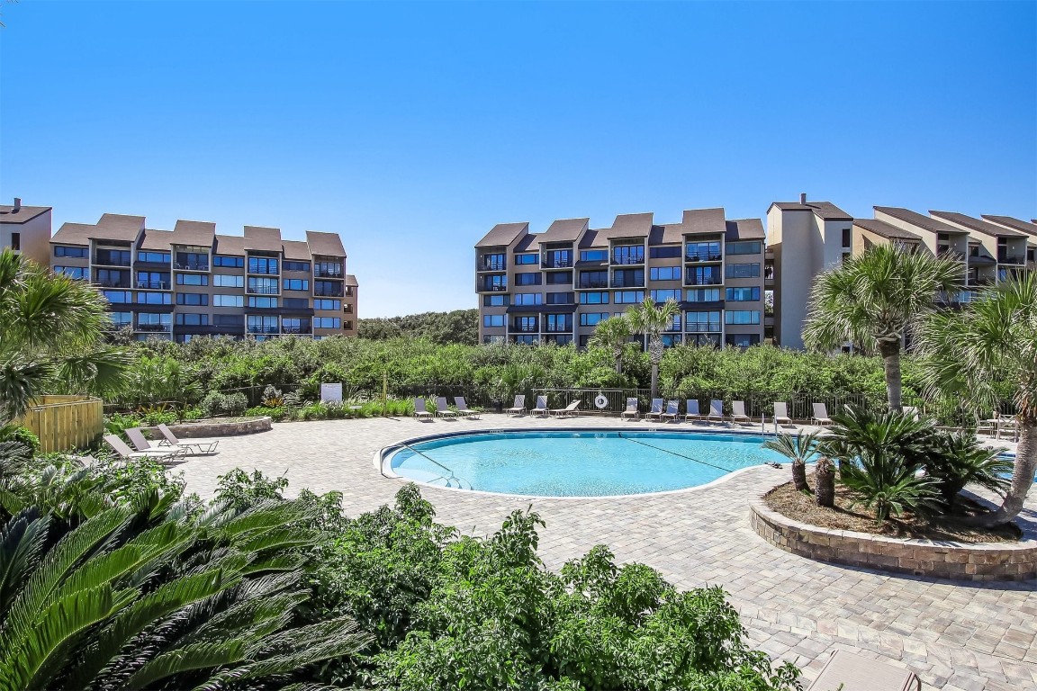 1163 Beach Walker Road, Unit 1163 Fernandina Beach, FL 32034 - Photo 34 of 52 a view of a swimming pool and a yard