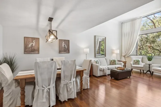 a living room with furniture and a large window with outer view