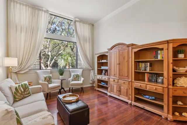 a view of a dining room with furniture wooden floor and a chandelier