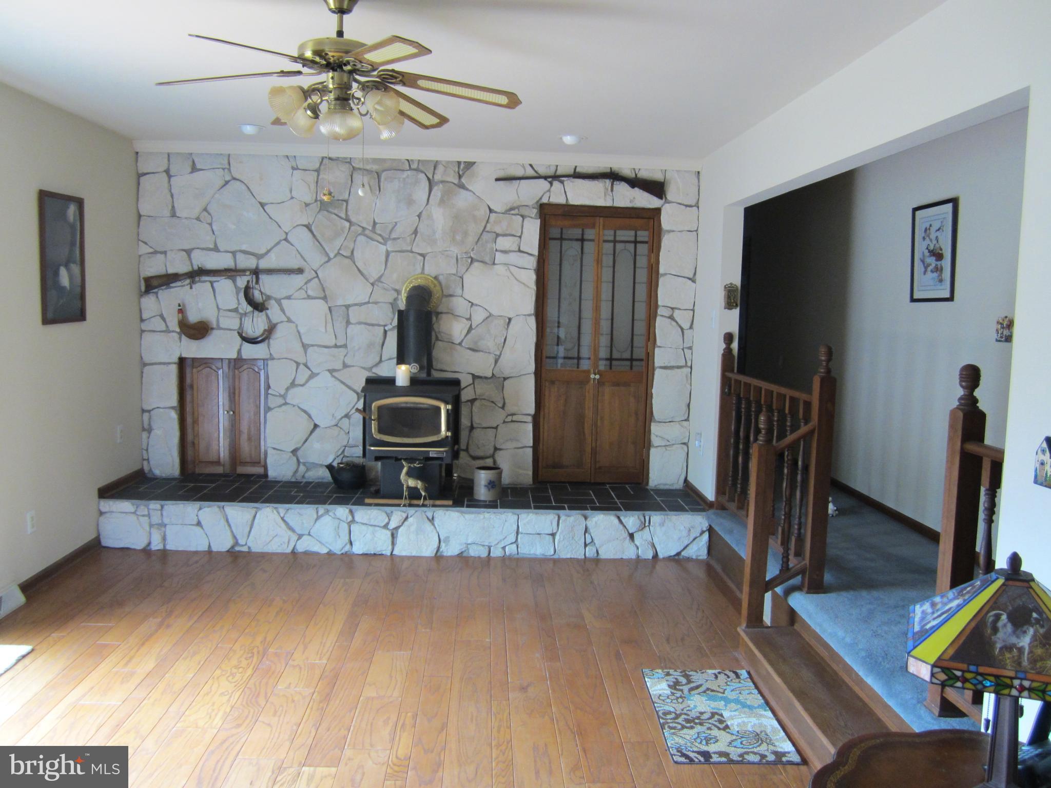 348 Eayrestown Road Southampton, NJ 08088 - Photo 12 of 32 a living room with fireplace furniture and a wooden floor